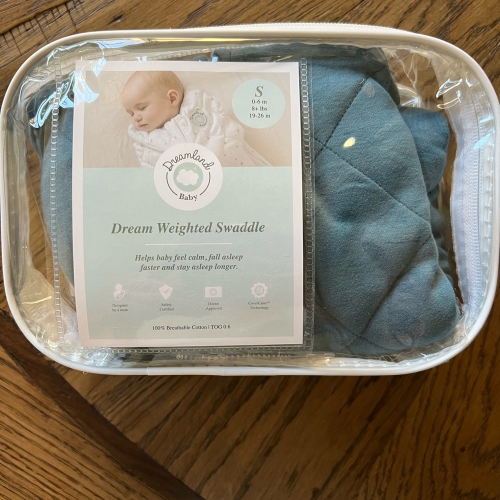 Dreamland weighted baby swaddle. Opened, but never used or washed.